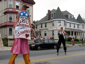 ../2011/10/02-1324-davis_sq-honk_parade-parade-stilts-class-warfare.jpg